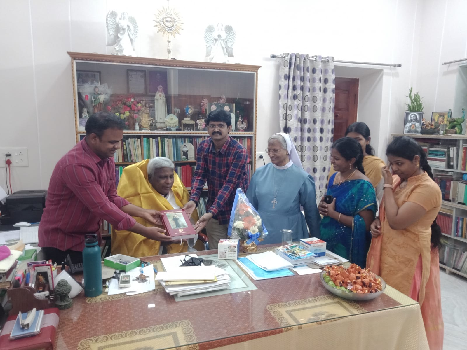 Book being handed to priests